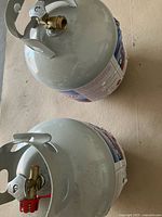 Top view showing both propane cylinders with valves and caps