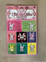 Front view of sealed It’s Happy Bunny magnet collection showing all nine magnets and packaging details
