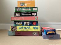 Stacked boxes showing all puzzles and game