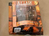 Front view of sealed Alias two-pack showing figures and packaging