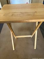 Full view of wooden folding TV tray table open