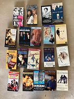 Overview of first group of VHS tapes on carpet