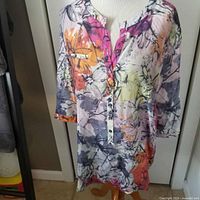 Floral multicolour button-front blouse on mannequin