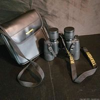 Binoculars with case, caps and strap