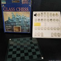 Box, board and styrofoam tray with pieces