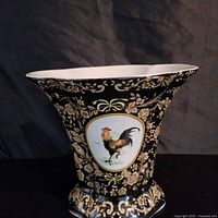 Full view of black and gold porcelain vase