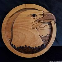 Front view showing carved eagle design