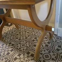 underside and leg detail of wood side table