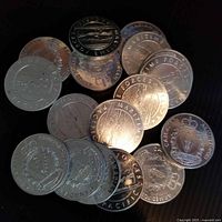 Stack of multiple Canadian Armed Forces commemorative coins