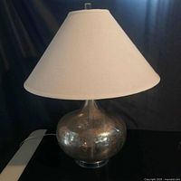 Full view of mercury glass lamp with shade
