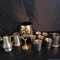 Group shot of all pewter and brass pieces