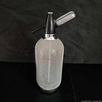 Full view of soda siphon showing mesh body and head