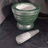 mortar interior and pestle laid beside