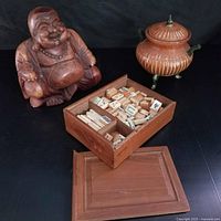 All three items grouped: Buddha statue, Mahjong set in box, tripod basket