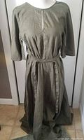 Front view olive-green linen dress with belt