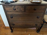 front view of dresser showing 2 small and 2 large drawers