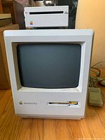 Front view of Macintosh Plus with external floppy drive stacked on top