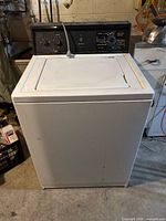 Front view of Kenmore top-load washer showing entire unit and control panel