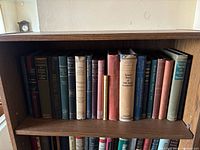 Top shelf containing assorted science and engineering hardbacks