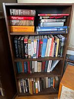 Full bookshelf showing all approximately 40 books in the lot