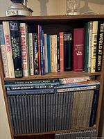 Bookshelf with mixed lot of gardening, history, travel, medical and reference books including a large grey encyclopedia set