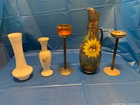 Group shot showing all five decorative pieces standing in a row
