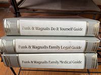 Spine view of three Funk & Wagnalls reference guides