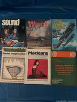 Six assorted hobby and news magazines laid out: Sound, Wings, Scale Modeler, Saturday Night, Maclean’s, Land