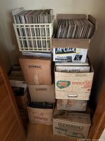 Stacked U-Haul boxes and crates filled with LPs