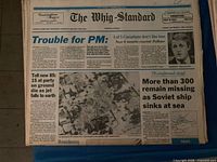 Top issue of stack, headline 'Trouble for PM' with aerial crash photo