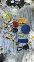 overview of all camping items spread on tarp