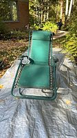 Front view of green folding lounge chair