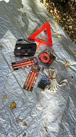 Group shot showing all automotive emergency items on tarp