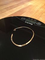 Bracelet laid on digital scale showing overall appearance