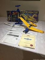 Complete set with plane, pump, spare wings, manuals, box