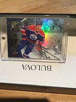 Front of Connor McDavid Stick Wizards card in protective case