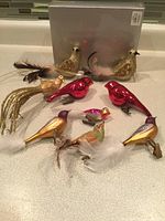 All eight bird ornaments displayed on countertop