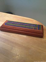 Top view of wooden cribbage board closed