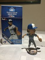 Bobblehead beside original box