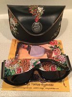 Sunglasses, leather case, and lens cloth together