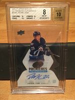 Front of Beckett-slabbed card showing Patrick Laine, autograph, serial 50/99, grade 8 label