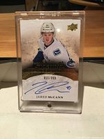 Front view showing Jared McCann image, autograph, and serial number 055/399 in top loader