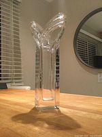 Full view of vase standing upright showing rectangular column and tulip rim