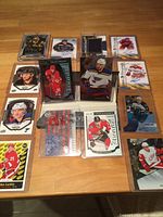 Overview of all rookie cards in three rows, showing protective top loaders and jersey insert