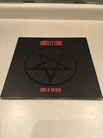 Front cover showing title and pentagram