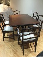 Table with six matching chairs around it