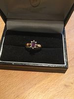 Ring in presentation box, showing overall design and stone setting