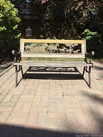 Front view of wrought iron bench with horse motif backrest