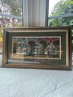 Full view of framed print on table