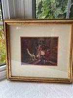 Framed print on window ledge, full view